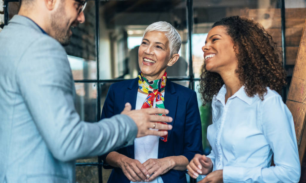 Colleagues having a spontaneous conversation in an informal workplace setting